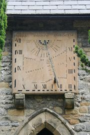 A vertical declining dial (south west) in Eyam Derbyshire England. 53°17′03″N 1°40′29″W﻿ / ﻿53.28420, -1.67471